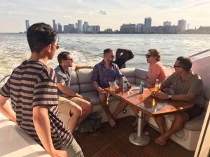 Justin Cobb on boat with employees